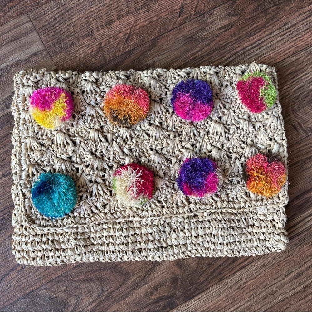 Serpui Marie Woven Straw Clutch with Colorful Pom-Poms Design